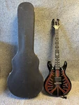 Schecter 6 String Diamond Series Devil Spine Red Electric Guitar With Hard Case. Fixed Price $850.00.