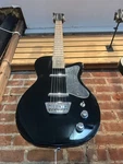 Silvertone 1303 Series Single Cut Electric Guitar - Black. Fixed Price $200.00.