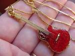 (M-303-C) Pick 1 Of 4 Colors Ovation Round Back Guitar Pendant Necklace Jewelry. Fixed Price $26.06.
