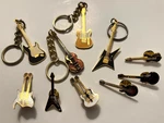 Fun And Collectible Guitar Keychains Tie Tacks - Never Used!. Fixed Price $12.95.
