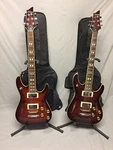 Lot Of 2 Schecter C-1E/A Hollow Body Tobacco Electric Guitars & Ritter Gig Bags. Fixed Price $1599.99.